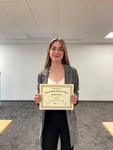 Runner-up 2, 2022 Award Winner Sandra Thiman with Award Certificate by University of Northern Iowa. Rod Library.