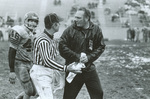 1970s Coach Sheriff talks to ref
