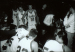 Players huddle, circa 2000