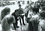 1996 coaches and players huddle