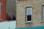 Watching march from rooftop 02 by Julie Berg-Raymond