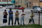 Hispanic men on the street by Julie Berg-Raymond