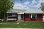 Postville house with American flag by Julie Berg-Raymond