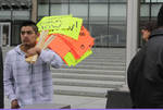 10- Man with protest signs by Araceli M. Castañeda