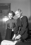 Two Students Ironing Dresses