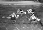 Women Swimming in Pool