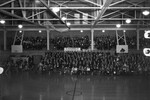 Gym Bleachers Filled During a Basketball Game