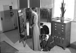Woman Trying on a Dress