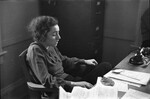 Woman Sitting at Desk 01