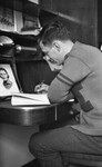 Man Writing at Desk 01