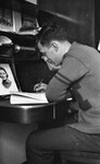 Man Writing at Desk 02